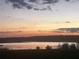 Scenic sunset view over the tranquil lake showcasing the stunning natural landscape at 16744 Sanctuary Dr, Winter Garden, FL 34787