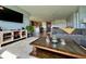 Open-concept living room with modern furnishings, hardwood floors, and ample natural light throughout at 16744 Sanctuary Dr, Winter Garden, FL 34787