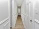 Hallway features wood-look flooring, chair rail, and white doors at 1913 South Blvd, Maitland, FL 32751