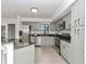 Modern kitchen with stainless steel appliances and gray cabinets at 1913 South Blvd, Maitland, FL 32751