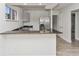 Kitchen with stainless steel refrigerator and breakfast bar with granite countertop at 1913 South Blvd, Maitland, FL 32751