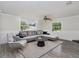 Spacious living room features hardwood floors, ceiling fan, and comfortable furniture at 1913 South Blvd, Maitland, FL 32751
