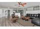Open living room with access to the kitchen, hardwood floors, and modern decor at 1913 South Blvd, Maitland, FL 32751