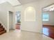 Bright hallway with hardwood floors and storage closet at 1125 English Garden Se Ln, Winter Garden, FL 34787