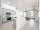 Modern kitchen with gray cabinets, quartz countertops, and stainless steel appliances at 1125 English Garden Se Ln, Winter Garden, FL 34787