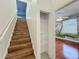 Staircase with wooden steps and a storage closet at 1125 English Garden Se Ln, Winter Garden, FL 34787