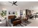 Open-concept living room with neutral tones, stylish furniture, and abundant natural light, creating a welcoming space at 2122 Whitney Marsh Aly, Orlando, FL 32804