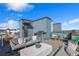 Comfortable rooftop deck features a dining table, grill, and lounge seating, perfect for outdoor entertaining at 2122 Whitney Marsh Aly, Orlando, FL 32804