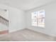 Neutral carpeted bedroom with a large window and bright natural light at 2138 Whitney Marsh Aly, Orlando, FL 32804