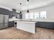 Spacious modern kitchen with gray cabinets, stainless steel appliances, and island at 2138 Whitney Marsh Aly, Orlando, FL 32804