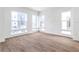 Bright living room features wood-look floors and multiple windows offering lots of natural light at 2138 Whitney Marsh Aly, Orlando, FL 32804