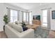 Living room with lots of natural light, neutral furniture, and wood-look flooring at 2138 Whitney Marsh Aly, Orlando, FL 32804