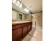 Double vanity bathroom with granite countertops and shower at 261 Carina Cir, Sanford, FL 32773