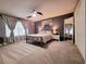 Main bedroom with ceiling fan, large window, and plush carpet at 261 Carina Cir, Sanford, FL 32773