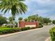 Community entrance with brick pillars and landscaping at 261 Carina Cir, Sanford, FL 32773