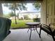 Private patio with table and chairs, overlooking a grassy area at 261 Carina Cir, Sanford, FL 32773