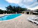 Community pool with lounge chairs and cabana at 261 Carina Cir, Sanford, FL 32773