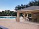 Community pool with covered patio and seating at 261 Carina Cir, Sanford, FL 32773