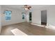 Bright bedroom with wood floors and a large closet at 27131 Racquet Cir, Leesburg, FL 34748