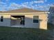 House exterior showcasing covered patio and grassy backyard at 366 Switchgrass Loop, Minneola, FL 34715