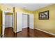 Bedroom featuring hardwood floors, a closet, and an adjoining bathroom perfect for convenience and privacy at 205 Hamlet Rd, Davenport, FL 33837