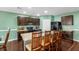 The kitchen features updated cabinetry, an island with seating, and modern appliances for a convenient cooking experience at 205 Hamlet Rd, Davenport, FL 33837