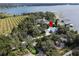 Expansive estate home nestled among mature trees, boasting manicured grounds and a serene setting at 12428 Summerport Ln, Windermere, FL 34786