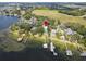 Stunning lakefront home with private docks and lush landscaping, offering serene waterfront living at 12428 Summerport Ln, Windermere, FL 34786