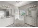 Elegant bathroom features double sinks, soaking tub and tiled finishes at 12428 Summerport Ln, Windermere, FL 34786