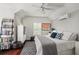 Well-lit bedroom with modern decor, hardwood floors, and ample closet space at 12428 Summerport Ln, Windermere, FL 34786
