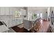 Open concept kitchen flows to dining area featuring white cabinets and a large center island at 12428 Summerport Ln, Windermere, FL 34786