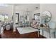 Elegant living room with hardwood floors, stylish furniture, and a neutral color palette at 12428 Summerport Ln, Windermere, FL 34786