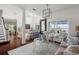 Open-concept living room with high ceilings, large windows, and a view of the lake at 12428 Summerport Ln, Windermere, FL 34786