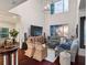 Spacious living room with high ceilings, large TV, and comfortable seating area at 12428 Summerport Ln, Windermere, FL 34786