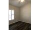 Bedroom with wood floors, large window and ceiling fan at 4559 Oak Arbor Cir, Orlando, FL 32808