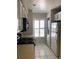 Efficient kitchen with white cabinetry, modern appliances and bright natural light at 4559 Oak Arbor Cir, Orlando, FL 32808