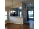 Open concept living space with breakfast bar that overlooks the kitchen and access to entry at 4559 Oak Arbor Cir, Orlando, FL 32808