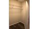 Walk-in closet featuring wire shelving and wood-look vinyl flooring at 4559 Oak Arbor Cir, Orlando, FL 32808