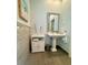 Serene bathroom with pedestal sink and decorative accents at 4901 Shoreline Cir, Sanford, FL 32771
