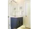 Modern bathroom features a vanity with marble countertop and brushed gold fixtures at 4901 Shoreline Cir, Sanford, FL 32771