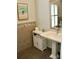 Serene bathroom with pedestal sink and decorative accents at 4901 Shoreline Cir, Sanford, FL 32771