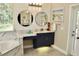 Well-appointed bathroom with double sinks, tub, and bright natural light at 4901 Shoreline Cir, Sanford, FL 32771