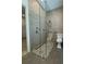 Bathroom features glass shower enclosure, pebble floor, and tile walls at 4901 Shoreline Cir, Sanford, FL 32771