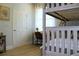 Well-lit bunk bedroom has wood-look floors and a desk at 4901 Shoreline Cir, Sanford, FL 32771