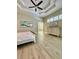 Bright bedroom showcasing an elegant dresser and ensuite bathroom at 4901 Shoreline Cir, Sanford, FL 32771