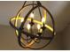 Close-up of an eye-catching light fixture with a metal frame and candelabra bulbs at 4901 Shoreline Cir, Sanford, FL 32771