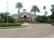 Community clubhouse surrounded by manicured landscaping, providing a welcoming and attractive amenity for residents at 4901 Shoreline Cir, Sanford, FL 32771