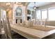 Bright dining room featuring a decorative fireplace, white furniture, and modern decor at 4901 Shoreline Cir, Sanford, FL 32771