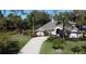 Stunning single-story home with lush landscaping and a circular driveway, perfect for suburban living at 4901 Shoreline Cir, Sanford, FL 32771