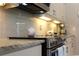 Modern kitchen with stainless steel appliances and granite countertops at 4901 Shoreline Cir, Sanford, FL 32771